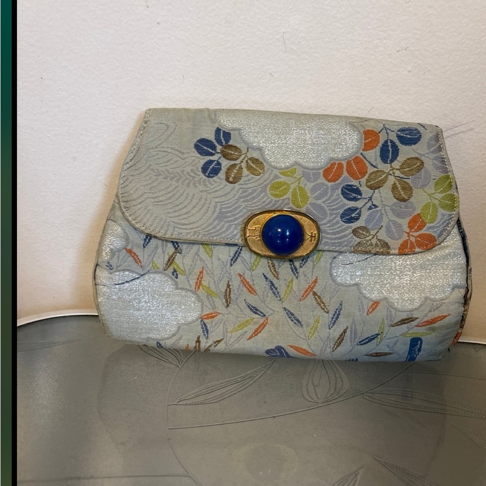 Floral Patterned Clutch with Blue Accent